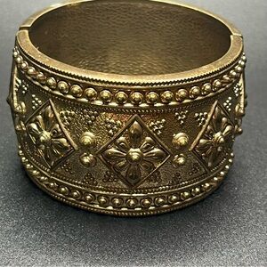 Vintage wide gold tone cuff bracelet embossed floral hinged statement